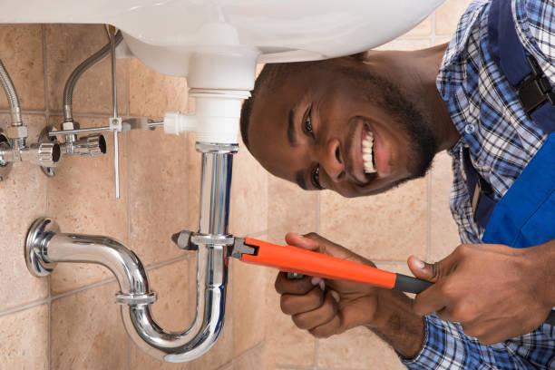 Plumber working on a pipe